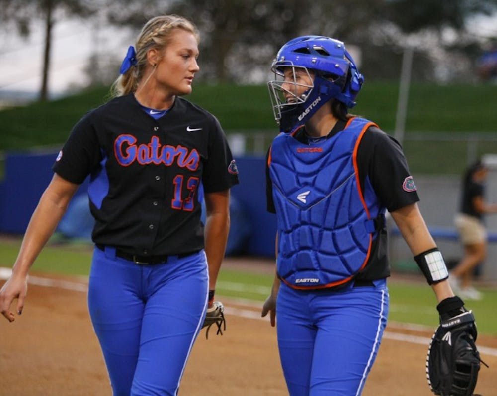 <p>Sophomore pitcher Hannah Rogers (left) said junior catcher Kelsey Horton (right) has adjusted well to playing behind the plate in place of injured starter and clean-up hitter Brittany Schutte.</p>