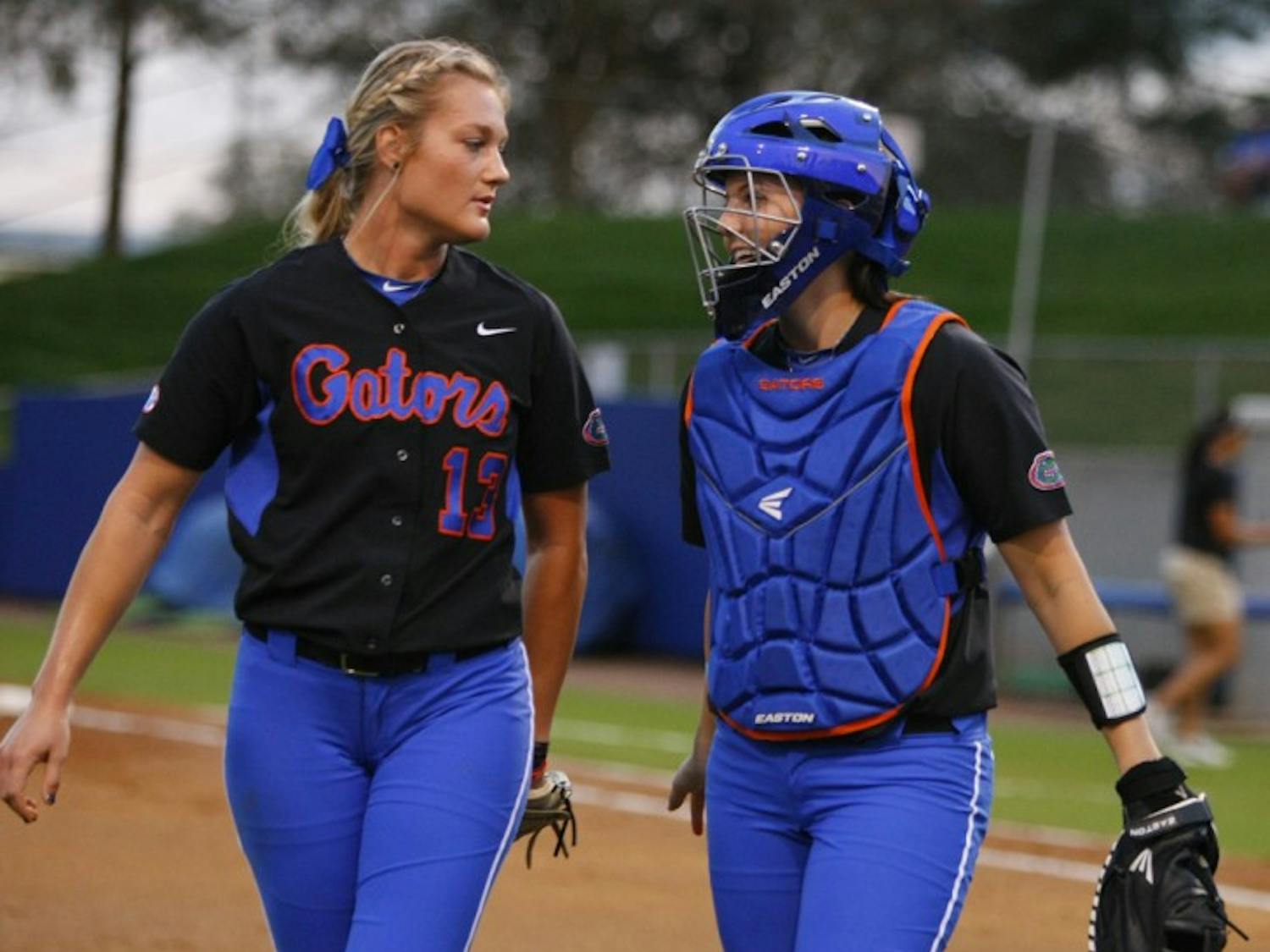 Sophomore pitcher Hannah Rogers (left) said junior catcher Kelsey Horton (right) has adjusted well to playing behind the plate in place of injured starter and clean-up hitter Brittany Schutte.