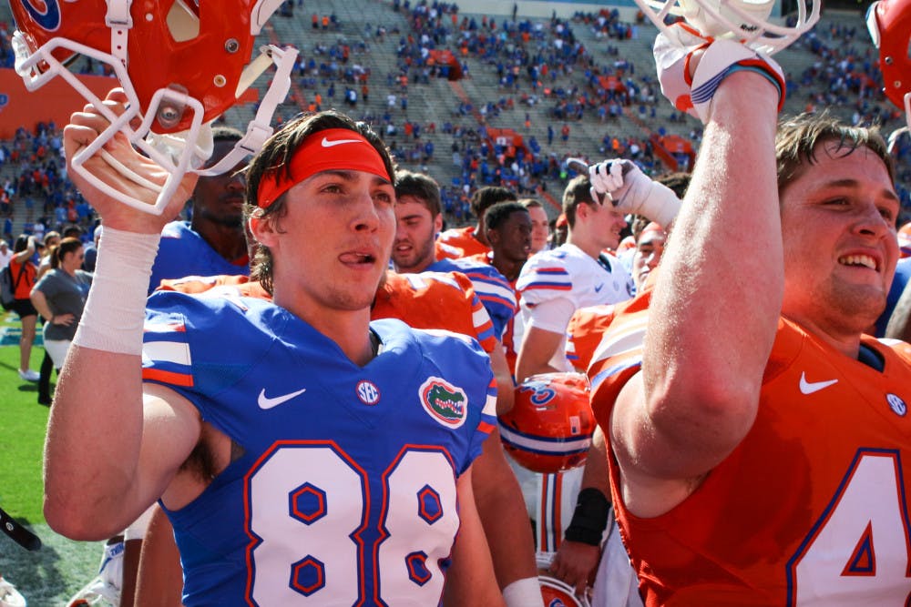 <p>UF punter Tommy Townsend and tight end R.J. Raymond celebrate after the Orange and Blue game on April 14.</p>