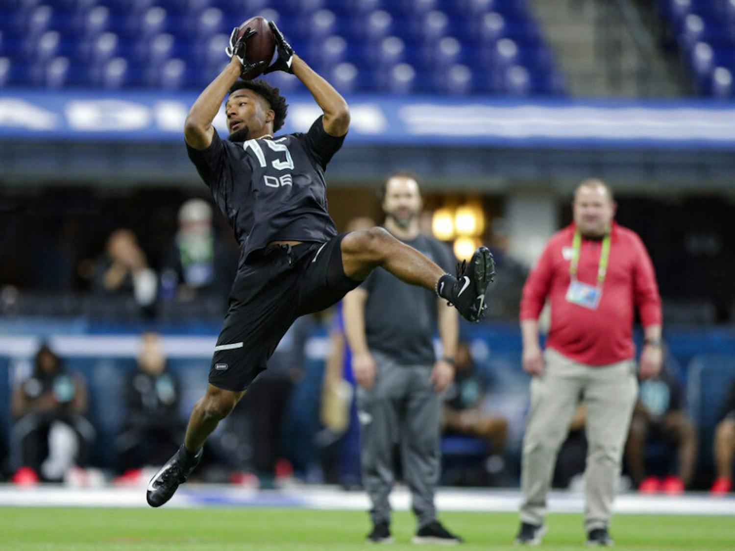 Florida defensive back C J Henderson runs a drill at the NFL football scouting combine in Indianapolis, Sunday, March 1, 2020. (AP Photo/Michael Conroy)