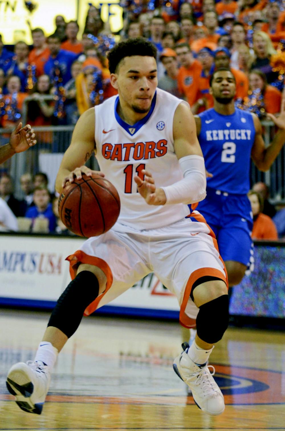 <p>Chris Chiozza drives the ball into the paint during Florida's 68-61 loss to No. 1 Kentucky on Feb. 7, 2014 in the O'Connell Center.</p>