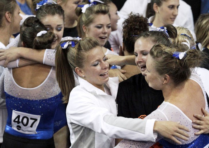 Members of the Florida team celebrate their victory in the NCAA women's gymnastics championships in Los Angeles on Saturday, April 20, 2013. (AP Photo/Reed Saxon)