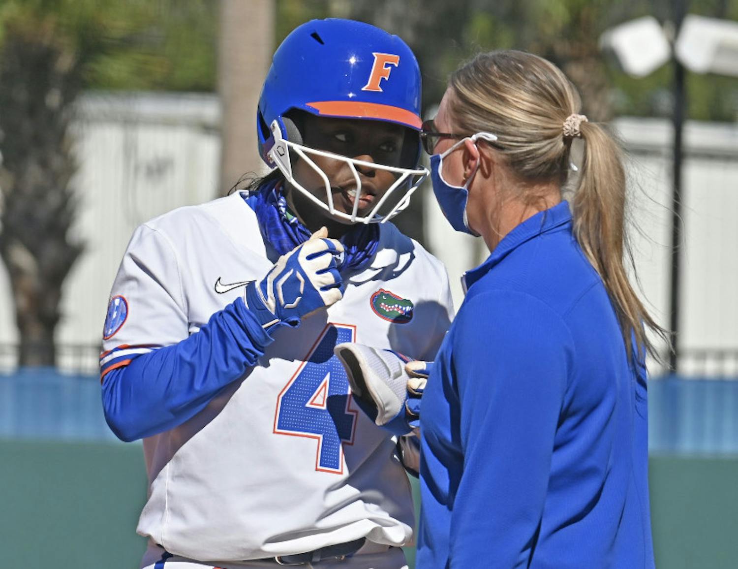UF third-baseman Charla Echols in conversation with a base coach. Echols notched an RBI-double Wednesday. 