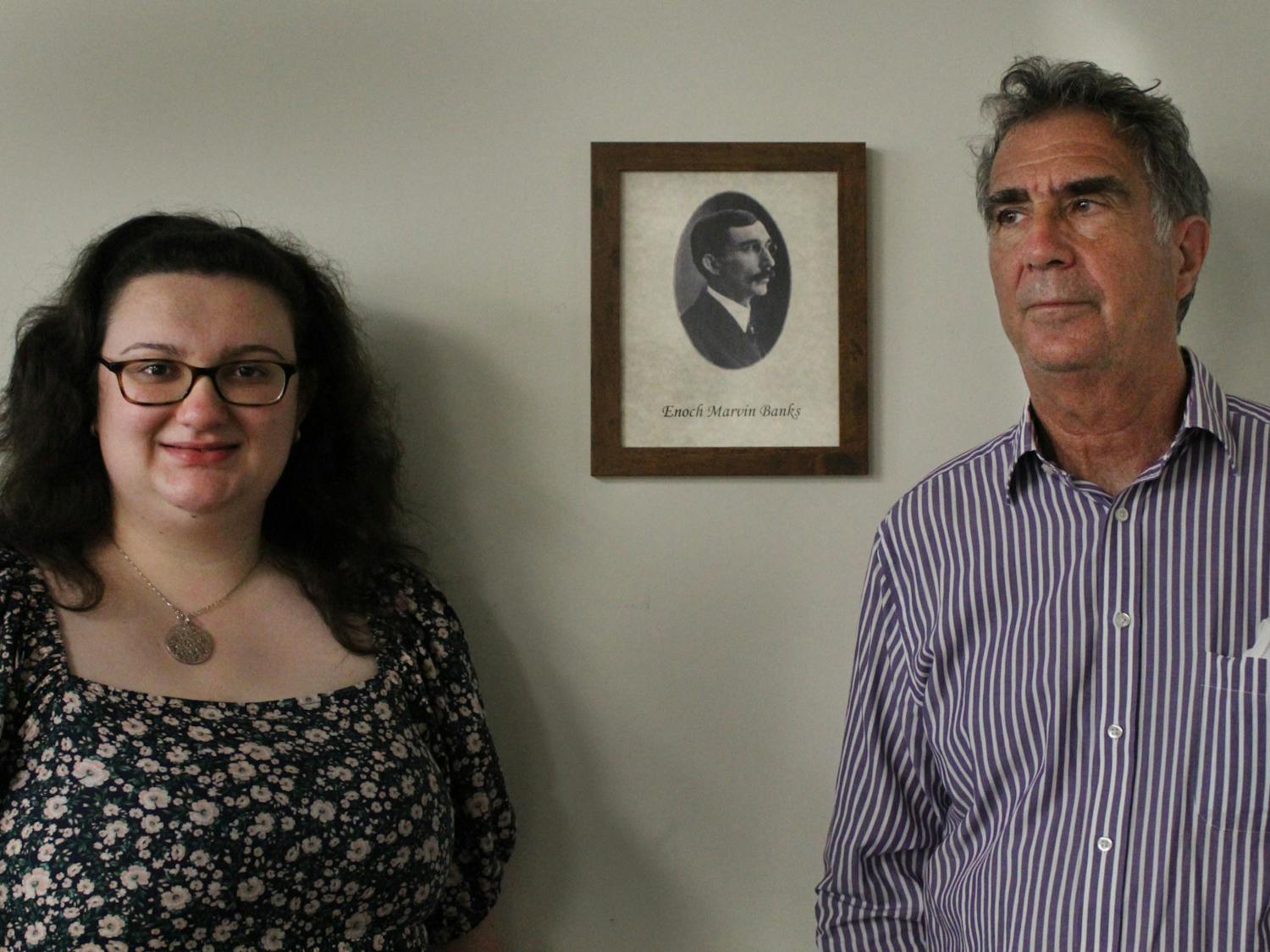 Briana Wiggins and professor Steven Noll pose for a portrait outside of the newly named Enoch Marvin Banks conference room on Thursday, April 7. 