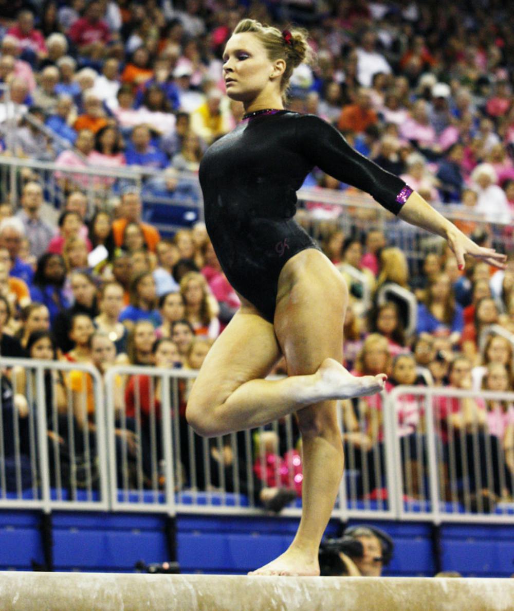 <p align="justify">Freshman Bridget Sloan performs her beam routine in Florida’s 197.65-196.025 win against Auburn on Jan. 25 at home.</p>