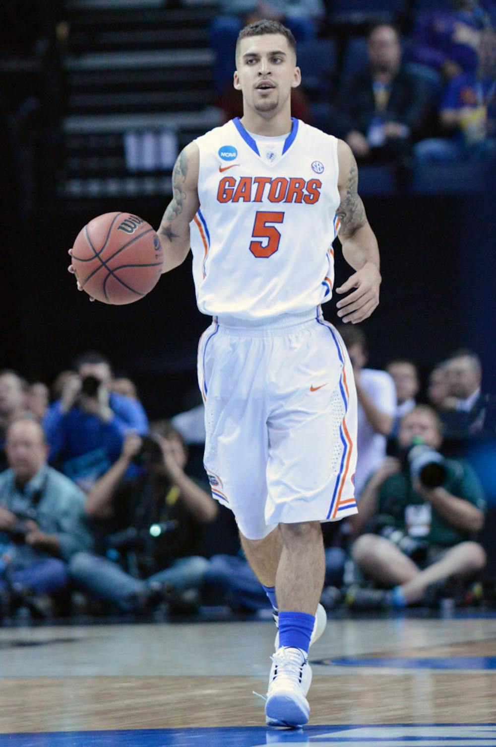 <p>Scottie Wilbekin drives down the court during Florida’s 79-68 win in the Sweet 16 round of the NCAA Tournament against UCLA on March 27 inside the FedExForum in Memphis, Tenn.</p>