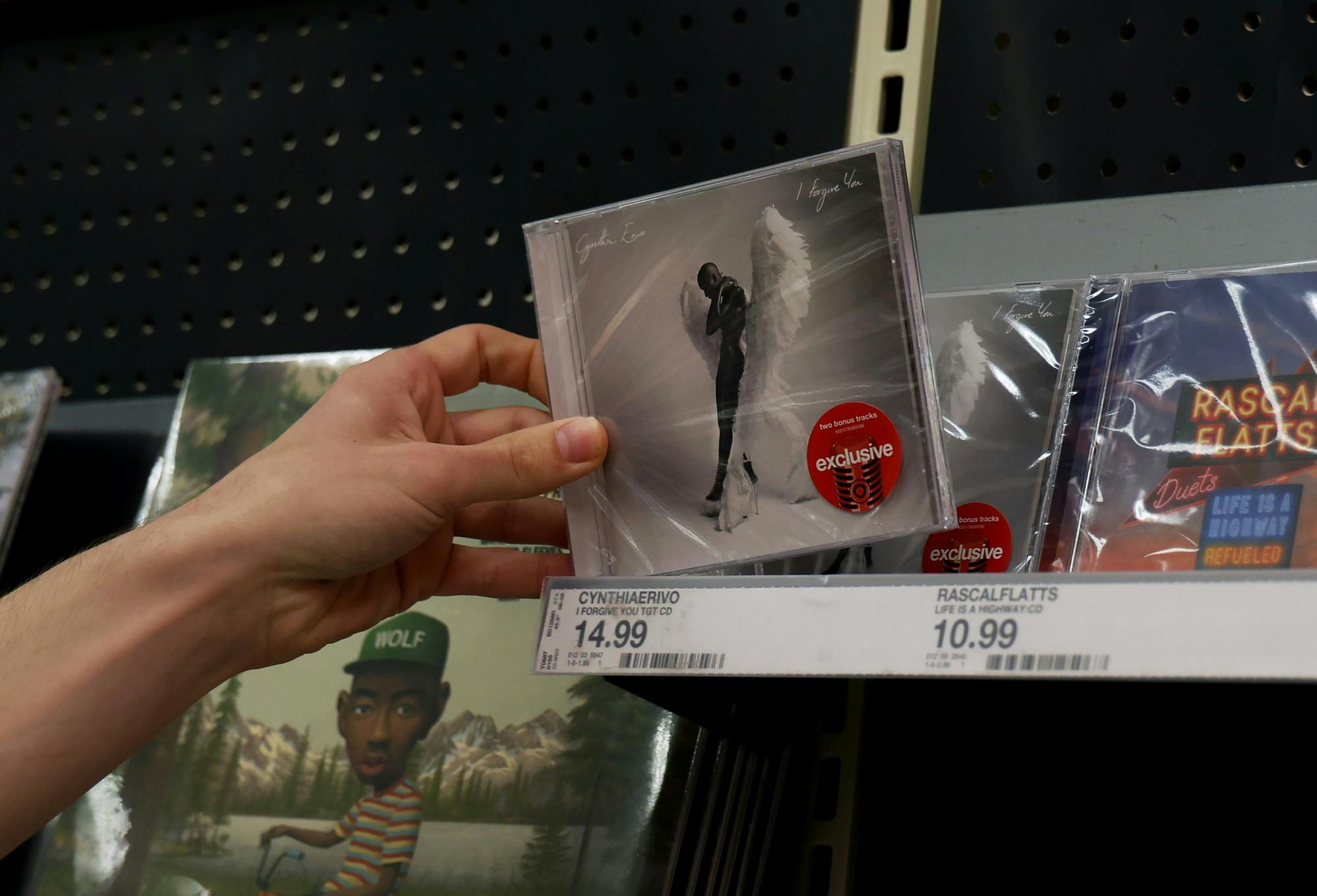 Brendan Schmidt places Cynthia Erivo's new album "I Forigive You" on the shelf in Target on June 8, 2025. 