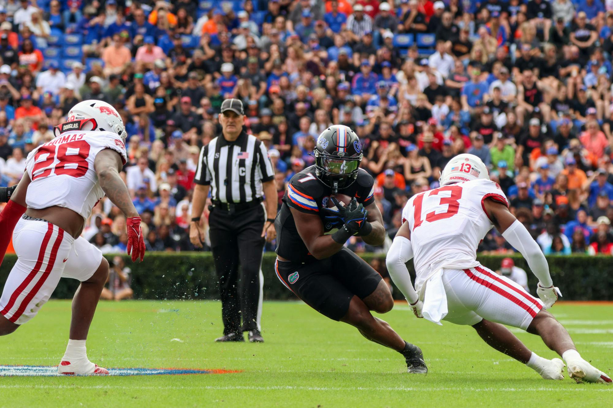 Sophomore running back Trevor Etienne carries the ball in the Gators’ 39-36 loss to the Arkansas Razorbacks on Saturday, Nov. 4, 2023.