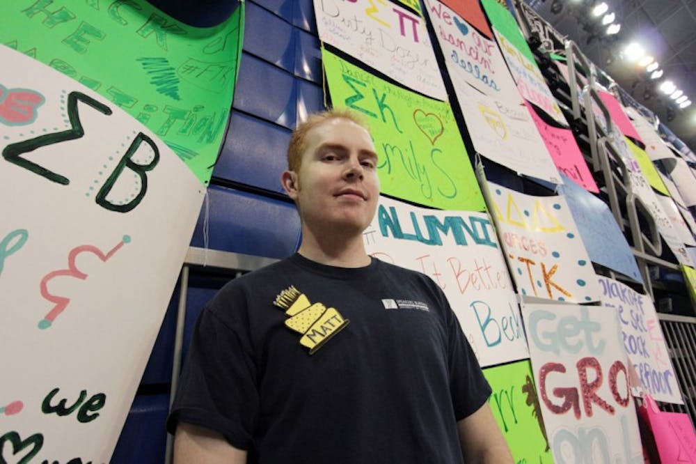 <p>Matt Michel poses for a photo at his ninth Dance Marathon event in the Stephen C. O'Connell Center early Sunday morning.</p>