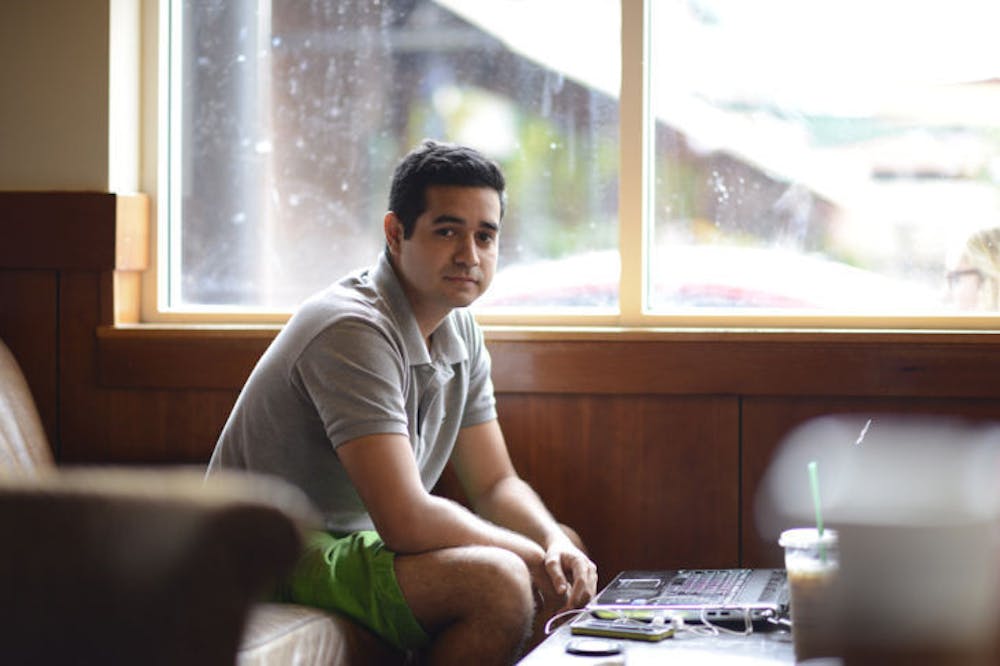 <p>Entrepreneur and recent UF graduate Patrick Arenson sits in the downtown Starbucks on Wednesday afternoon. The 23-year-old has written two books and is raising money on Kickstarter to publish his third.</p>