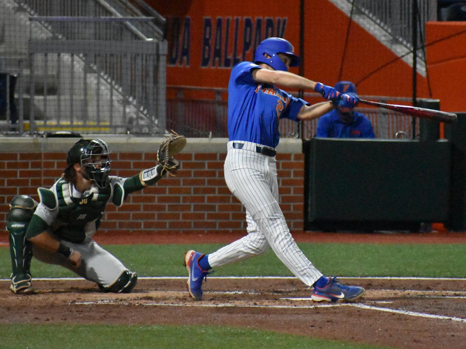 Florida&#x27;s Sterlin Thompson swings against Jacksonville on March 13, 2021. Thompson hit a solo home run on Tuesday against the North Florida Ospreys en route to a 11-2 victory.