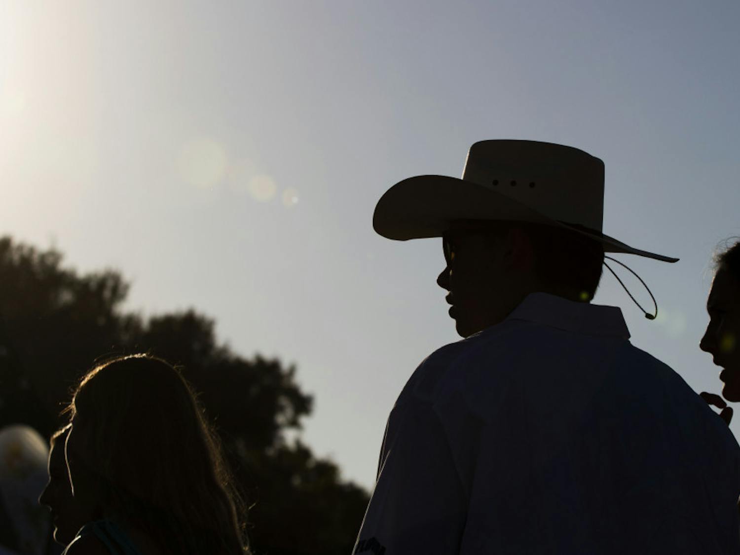 Ben Kamberg, a 20-year-old UF political science sophomore, waits in line Friday evening to play a game of Plinko before the concert started at Gator Growl. Kamberg said he is a Chase Rice fan and that he likes country because he comes from a rural part of Florida.