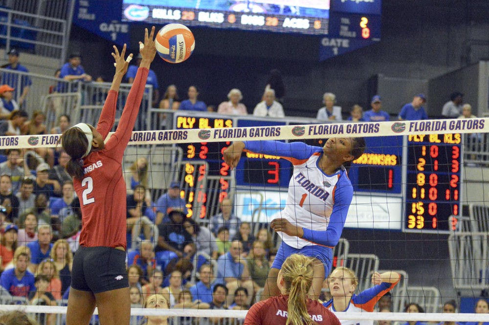 <p>Rhamat Alhassan (1) swings for a kill attempt during Florida's 3-0 win against Arkansas on Sunday in the O'Connell Center.</p>