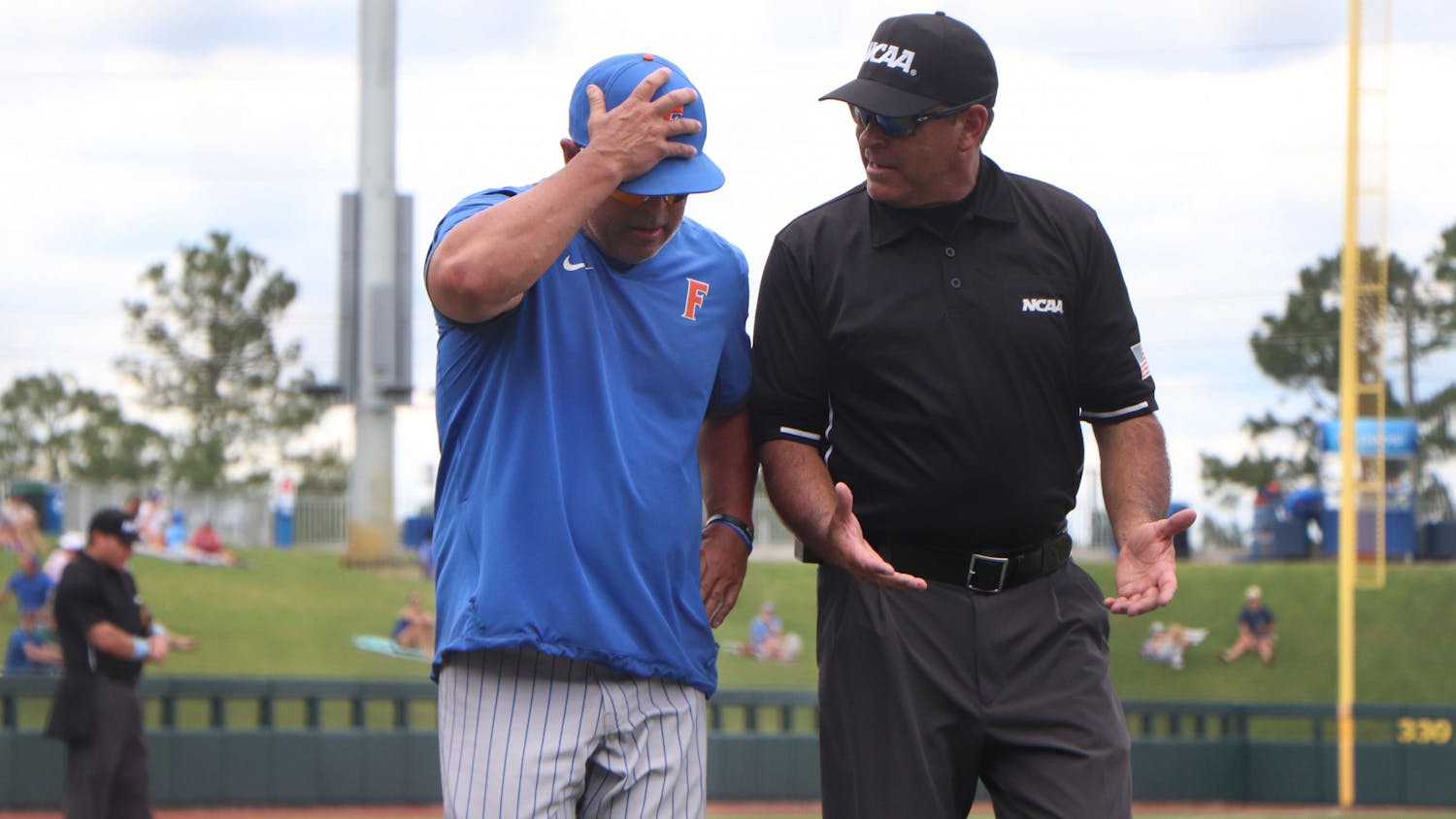 Florida baseball head coach Kevin O'Sullivan argues with an umpire after a waved-off ground ball in the sixth inning of a 19-1 loss to South Alabama on June 5. The loss ended the unanimous preseason No. 1's season at just 38-22 after being swept out of its own regional.