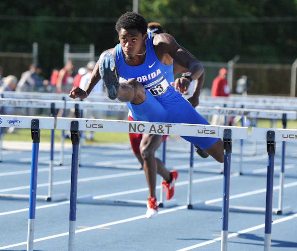 <p>Eddie Lovett leaps over a hurdle during an NCAA East Preliminary Round in Greensboro, N.C., on May 24, 2013. Lovett played with former UF safety Matt Elam in high school.</p>