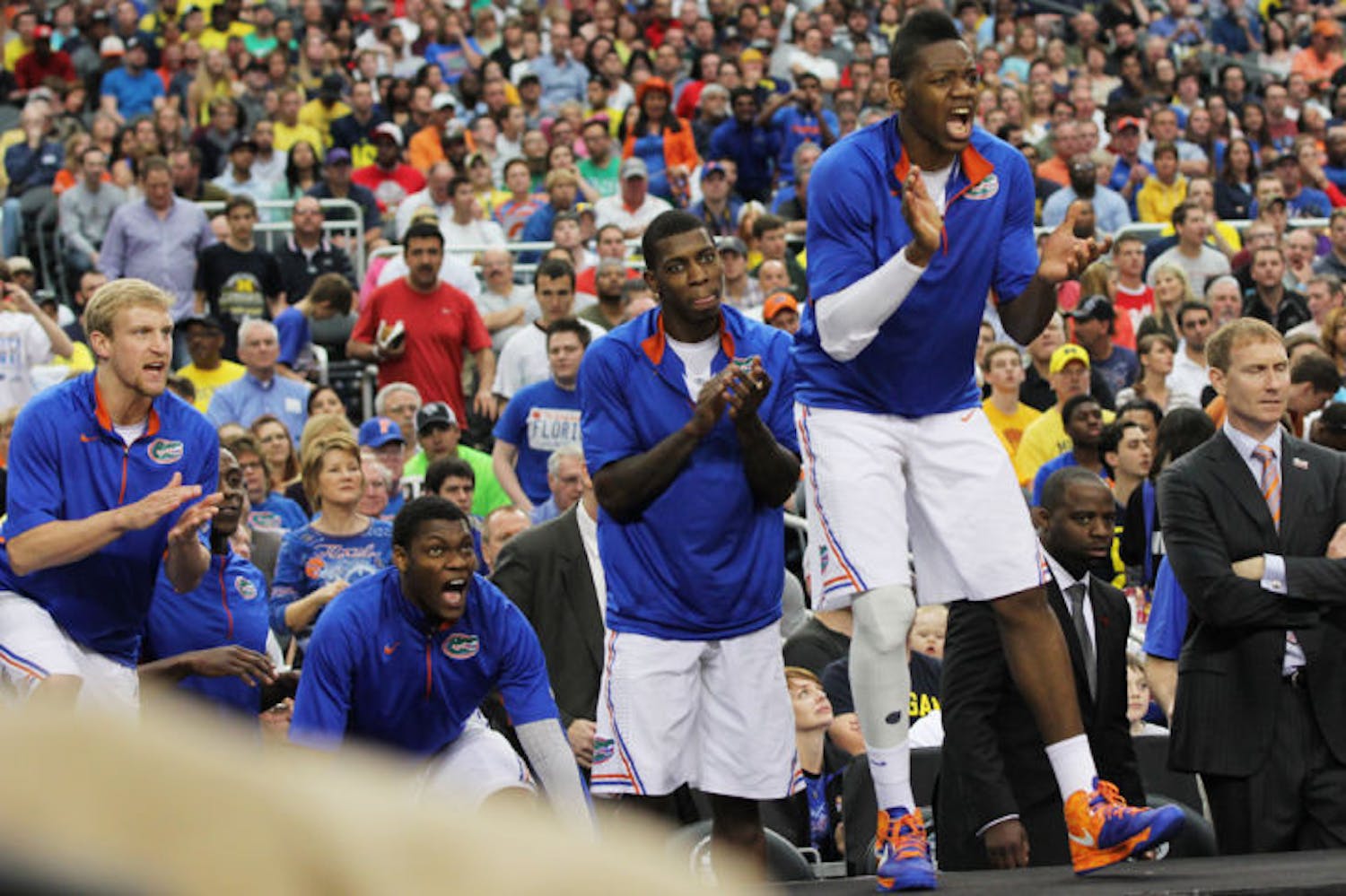 Will Yeguete (15) cheers for his teammates during Florida’s 79-59 loss to Michigan on March 31 in Arlington, Texas.