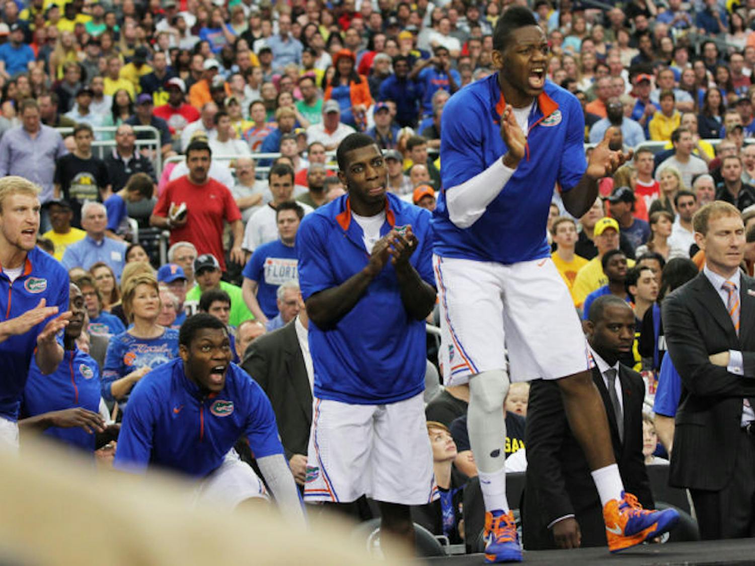 Will Yeguete (15) cheers for his teammates during Florida’s 79-59 loss to Michigan on March 31 in Arlington, Texas.