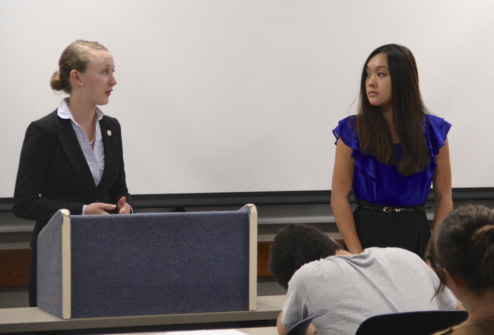 From left: Bridget Sullivan, an 18-year-old UF nutritional sciences freshman, defends concealed carry on campus as Gloria Li, a 19-year-old UF environmental science sophomore, cross-examines. The Campus Carry Debate event was hosted by Students for Concealed Carry at UF and the UF Speech and Debate Team.