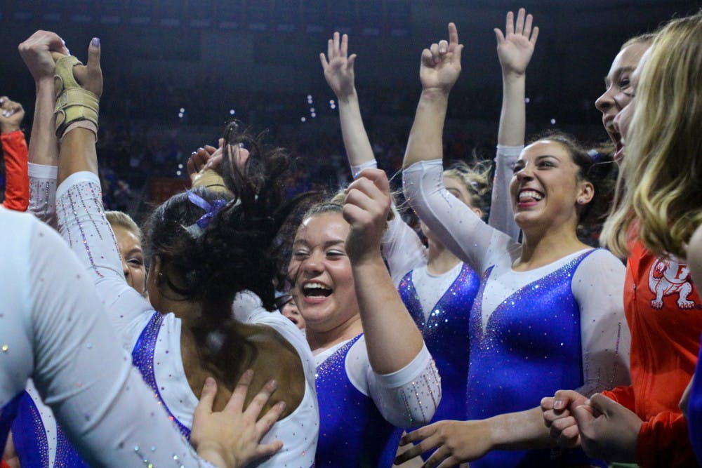 Florida's gymnastics team finished second at the NCAA Championships on Friday night in St. Louis, securing a spot in Saturday's Super Six team final.