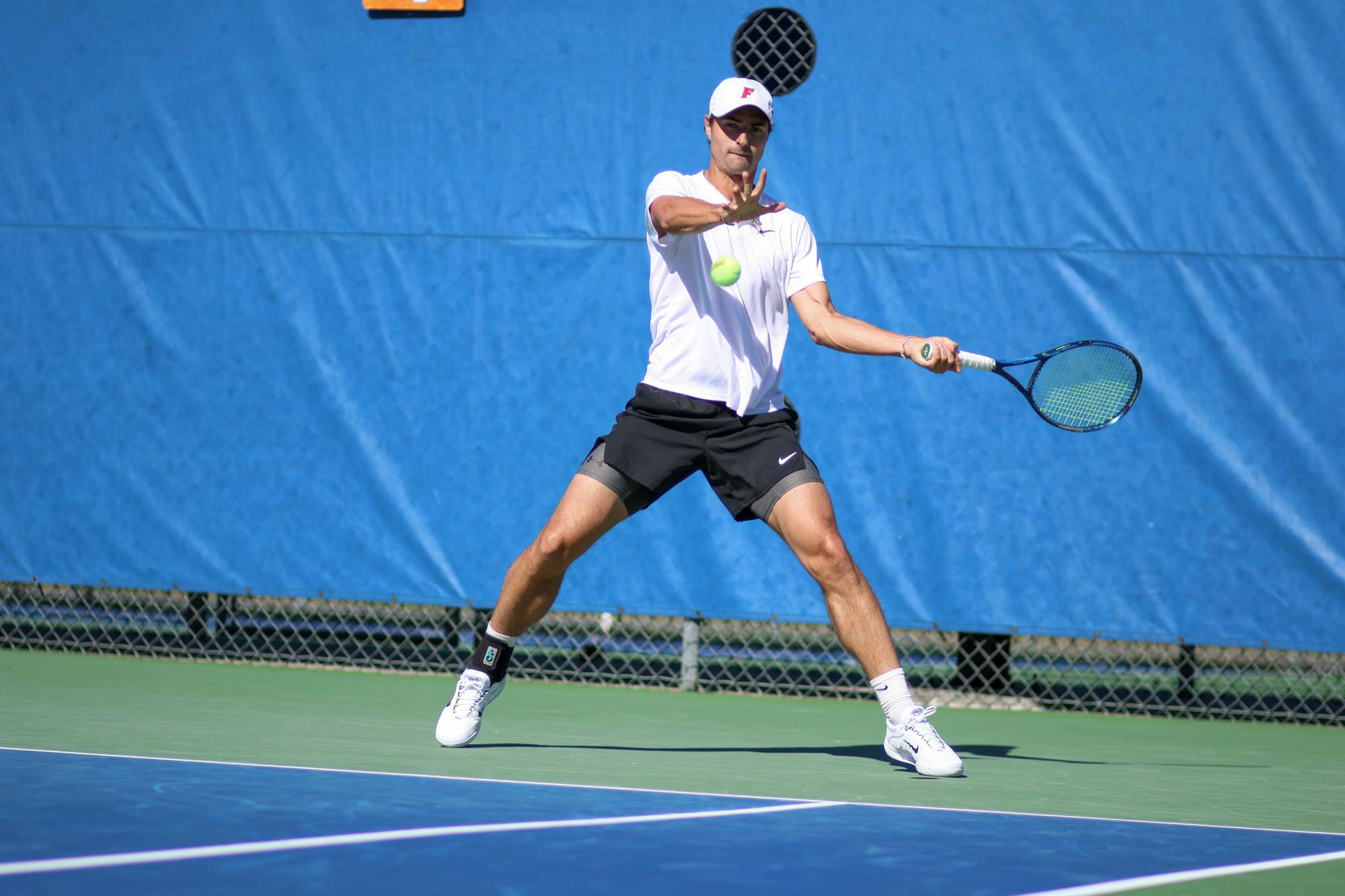 Florida graduate student Axel Nefve hits the ball in the Gators' 5-2 loss to the No. 8 Texas Longhorns Sunday, Jan. 15, 2023.