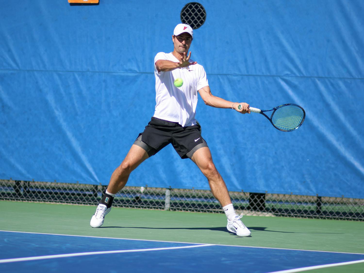 Florida graduate student Axel Nefve hits the ball in the Gators' 5-2 loss to the No. 8 Texas Longhorns Sunday, Jan. 15, 2023.