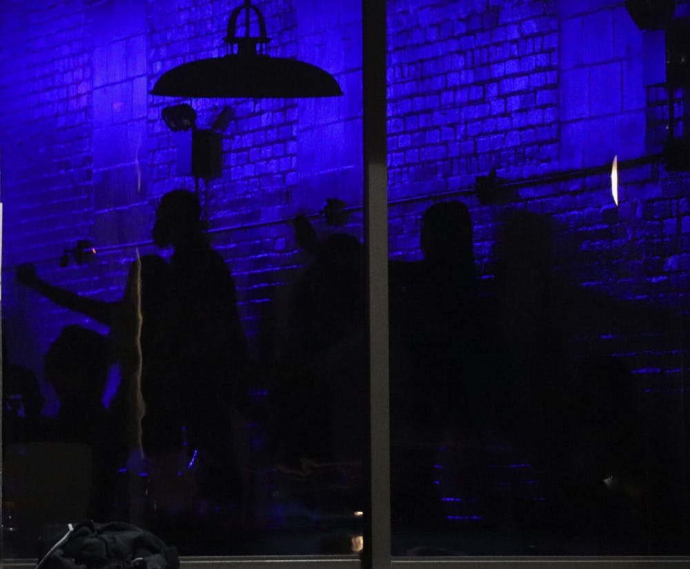 People are seen dancing inside of The Range, located off of 2nd Avenue in Downtown Gainesville on Saturday night, after the first home football game of the season. (Chasity Maynard/Alligator Staff)