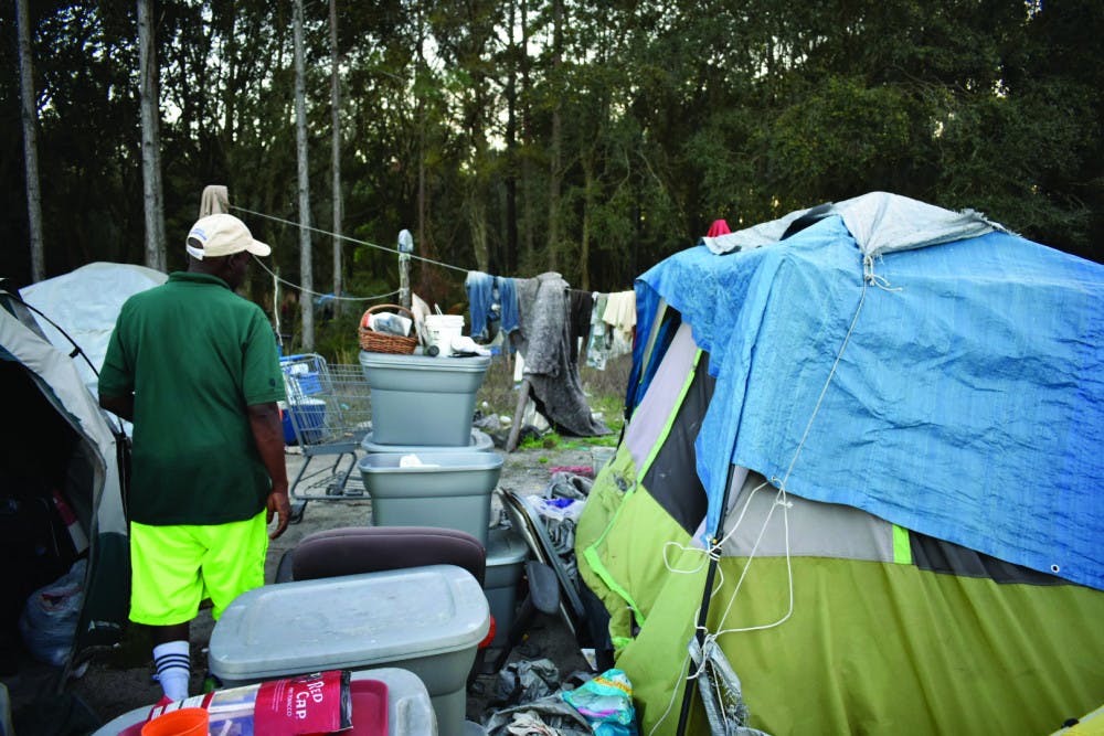 Rupert Heard, 55, gives a tour of his camp fit for three. As camp leader, he manages his group’s finances and stocks up on daily supplies.