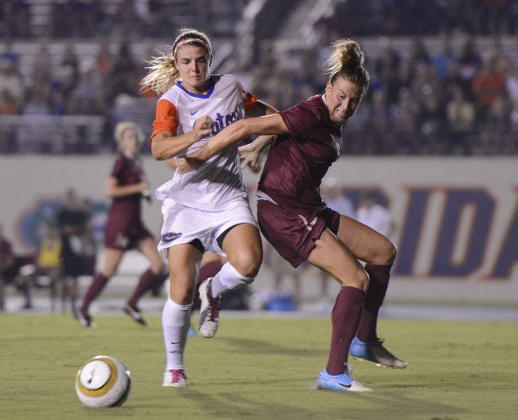 Savannah Jordan (left) pushes past an opponent during Florida’s 3-0 loss against Florida State on Aug. 30 at James G. Pressly Stadium.