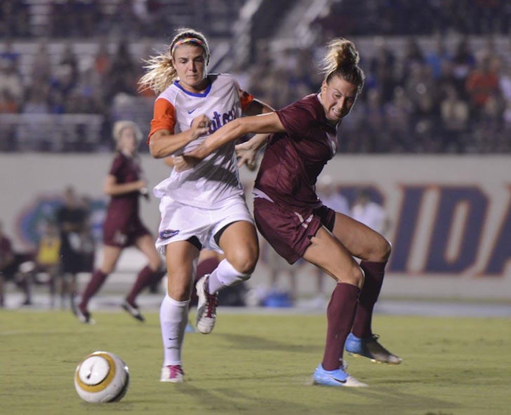 <p>Savannah Jordan (left) pushes past an opponent during Florida’s 3-0 loss against Florida State on Aug. 30 at James G. Pressly Stadium.</p>