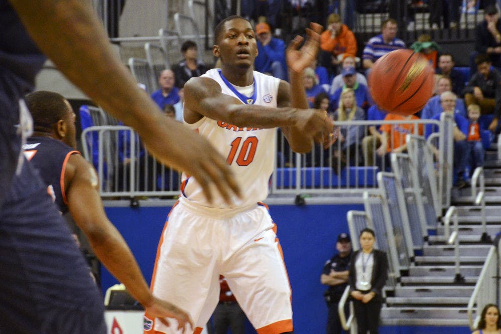 Dorian Finney-Smith passes the ball during Florida's 75-55 win against Auburn on Thursday in the O'Connell Center.
