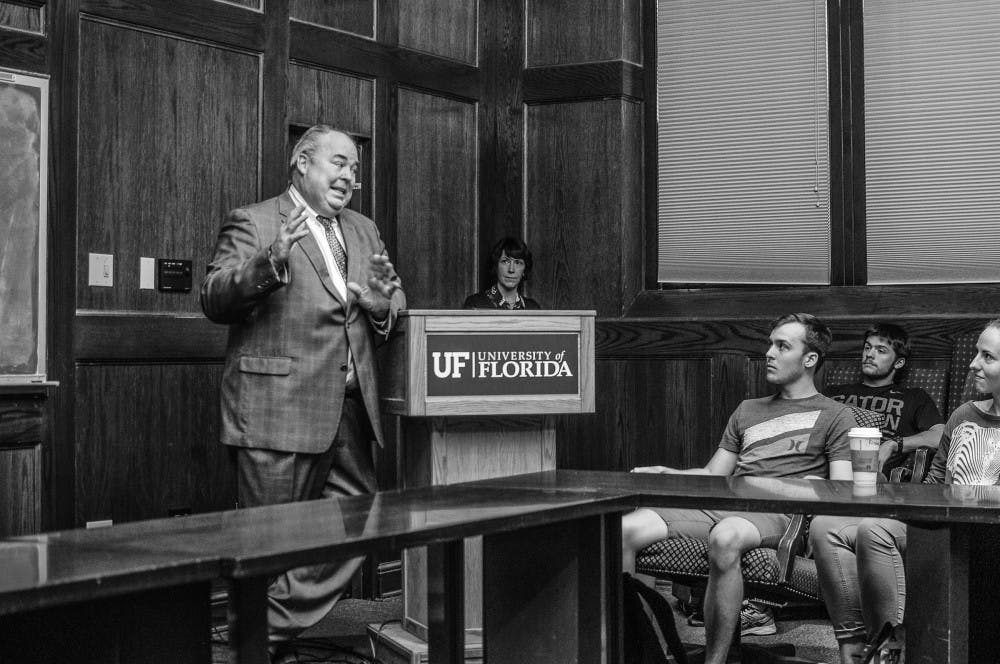 UF alumnus and former Foreign Service Officer Carey Cavanaugh gives a speech to prospective U.S. State Department students on Monday. Alec Werthman, a  21-year-old UF biochemistry and molecular biology senior attending the talk, said he initially attended the lecture to satisfy a class requirement, but later realized it helped solidify his career choices.