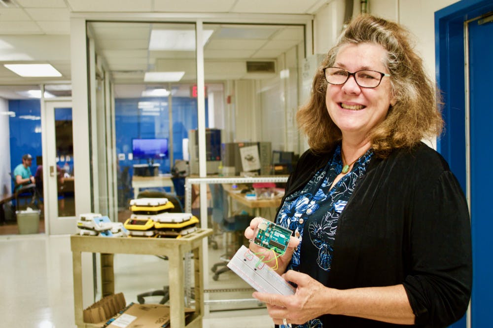 Nancy Ruzycki, a UF lecturer and the director of undergraduate laboratories at the Herbert Wertheim College of Engineering Department of Materials Science and Engineering, holds Arduinos, an type of open-source electronic, to create lab experiments involving data collection and analysis. Courtesy to The Alligator. 