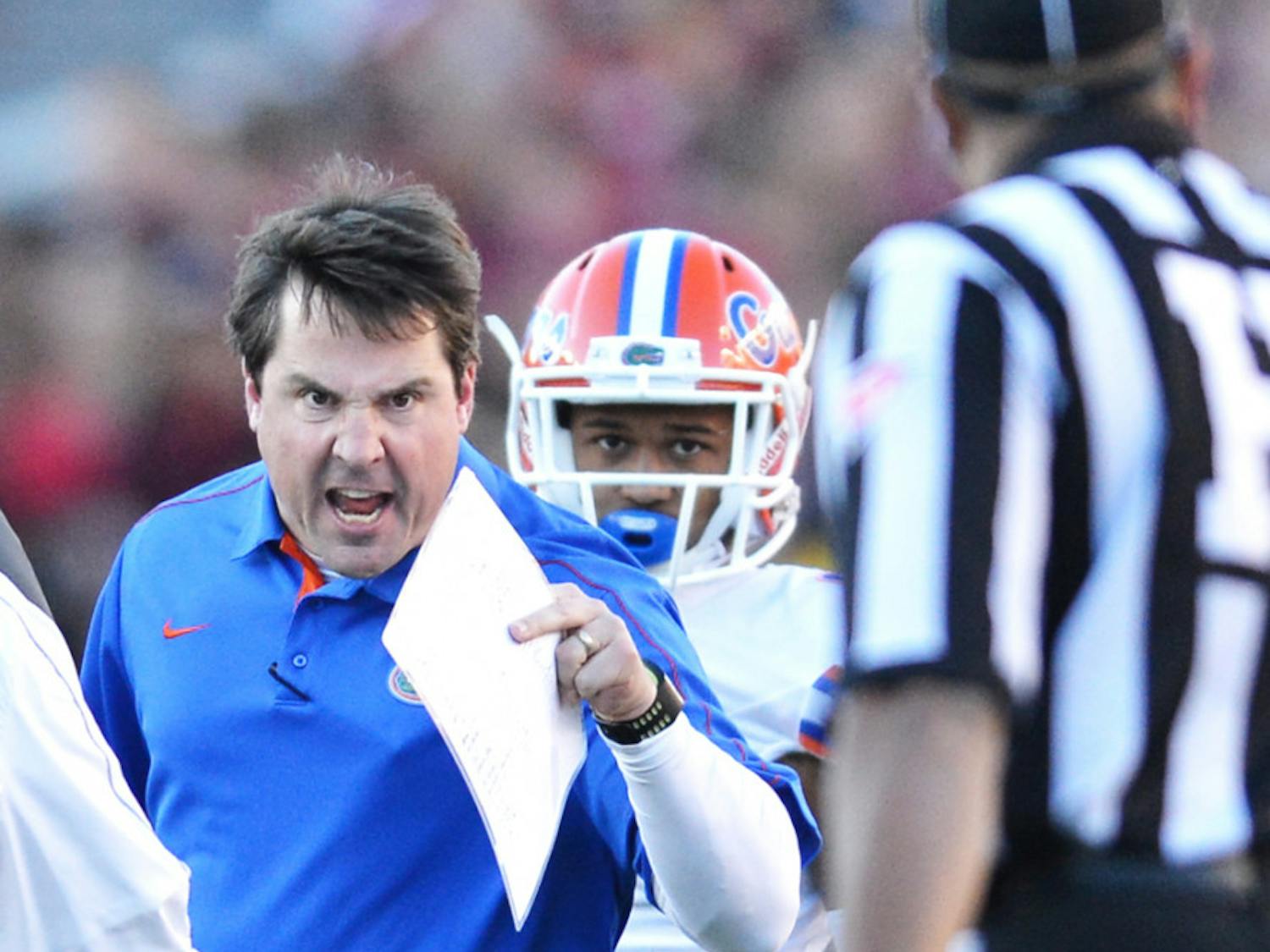 Coach Will Muschamp exchanges words with an official during Florida’s 37-26 win against Florida State on Saturday at Doak Campbell Stadium in Tallahassee.
