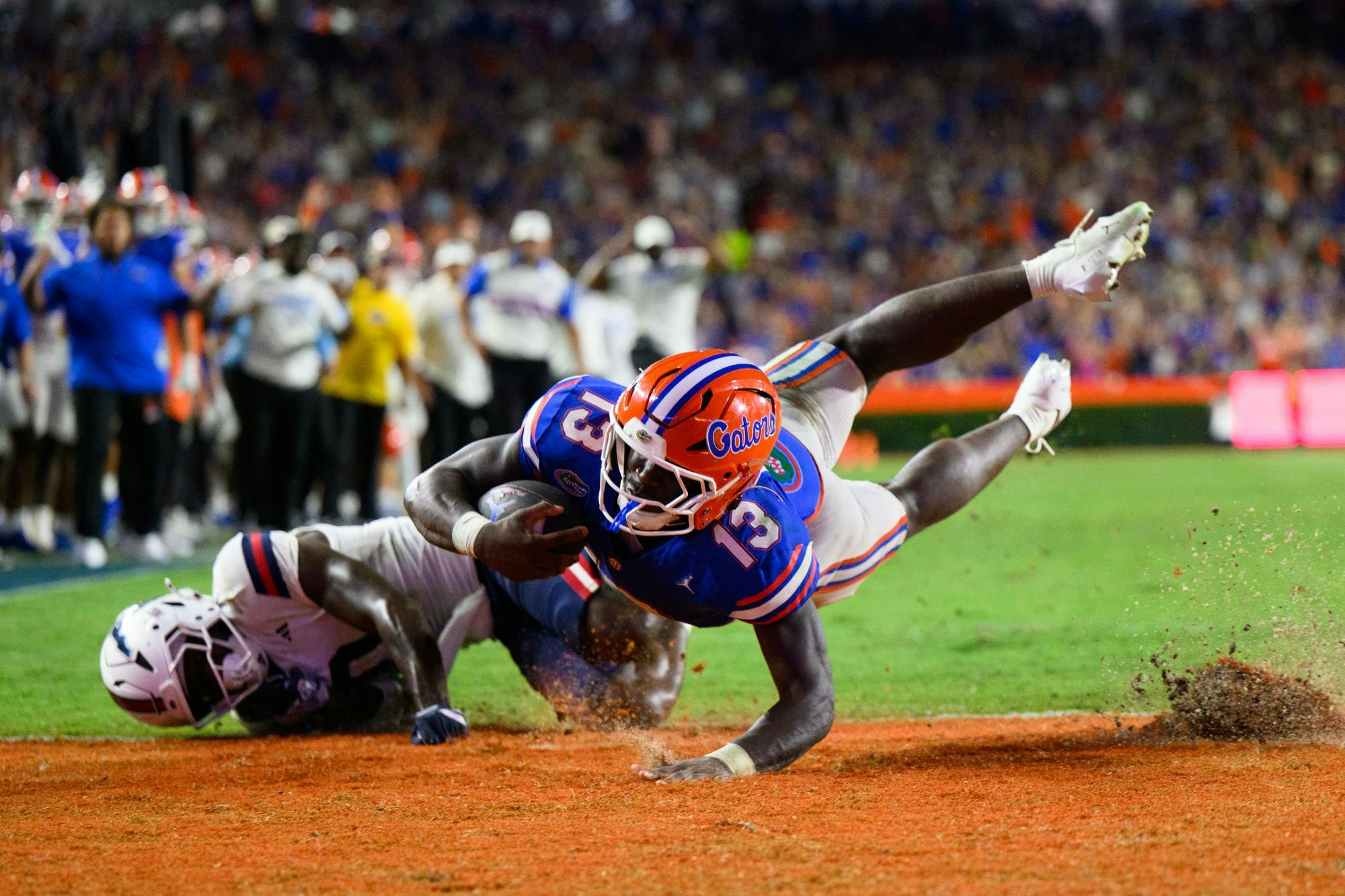 Florida running back Jadan Baugh (13) scores a touchdown during the first half of an NCAA college football game against FAU, Saturday, Sept. 5, 2026, in Gainesville, Fla.