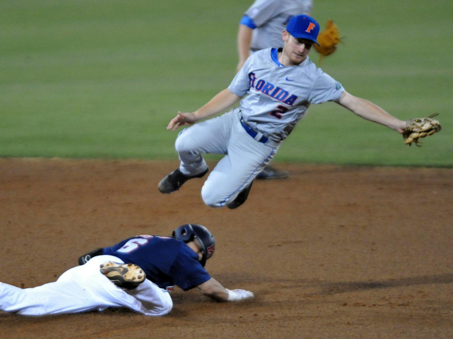 Mississippi's Blake Newalu (6) steals second as the ball gets past Florida's Caey Turgeon (2) during a college baseball game in Oxford, Miss. on Friday, March 30, 2012. (AP Photo/Oxford Eagle, Bruce Newman)