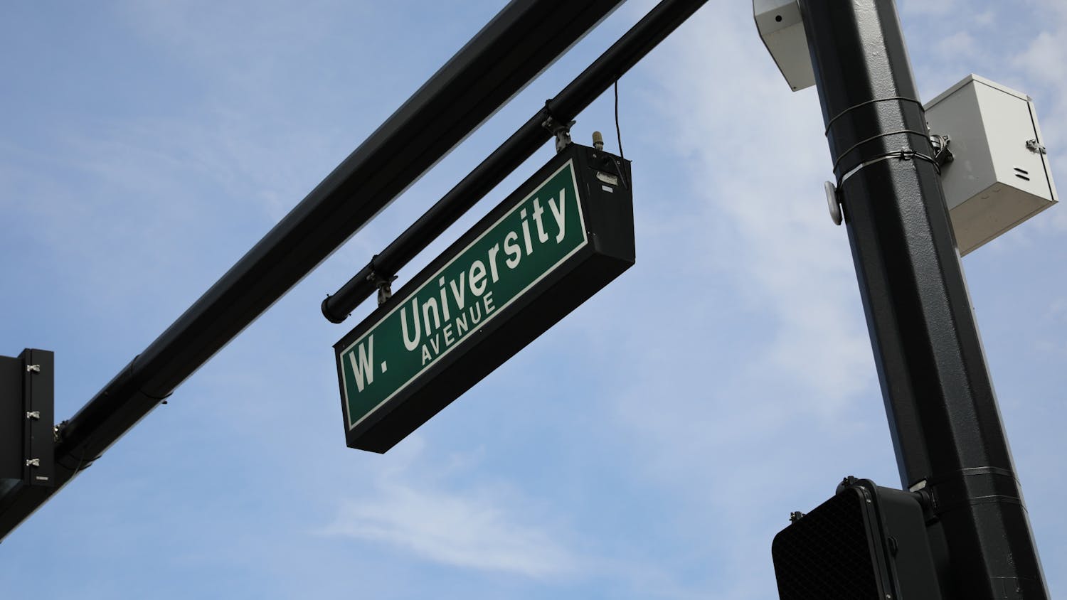 The street sign for West University Avenue along the UF campus on Sunday, June 6, 2021. The Newell Gateway, one of two gateways to be constructed, will be implemented at the intersection of Newell Drive and West University Avenue as part of an effort to create an auto-free zone at the core of campus.