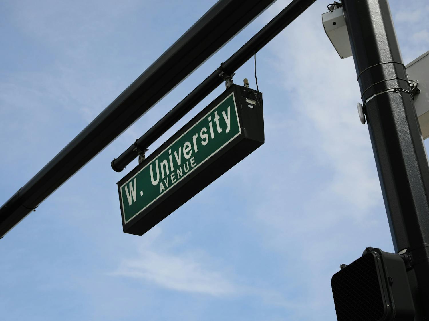 The street sign for West University Avenue along the UF campus on Sunday, June 6, 2021. The Newell Gateway, one of two gateways to be constructed, will be implemented at the intersection of Newell Drive and West University Avenue as part of an effort to create an auto-free zone at the core of campus.