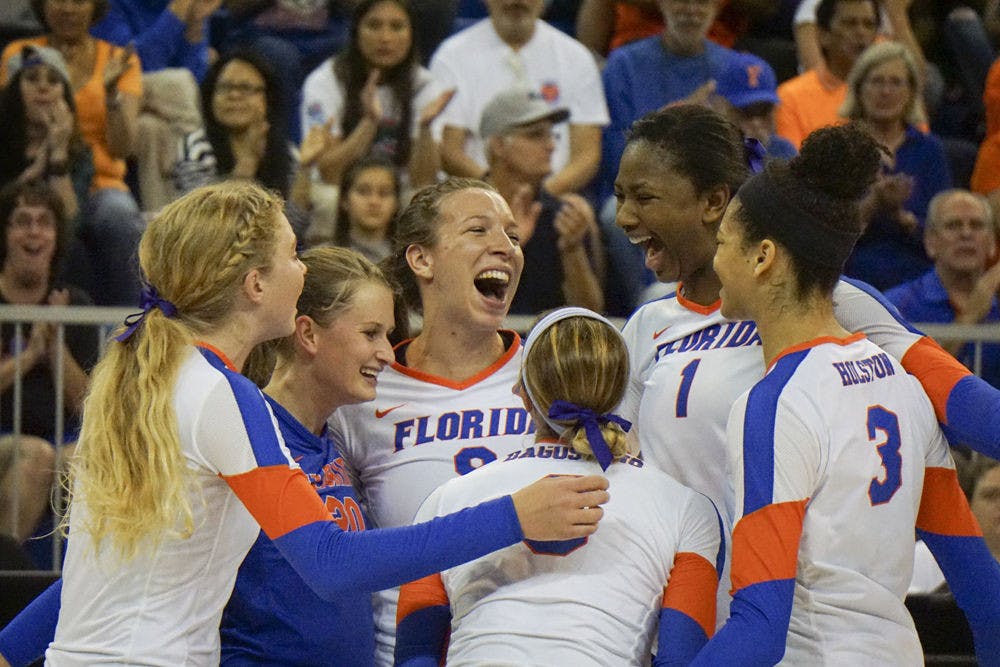 <p>UF outside hitter Ziva Recek (middle) celebrates with teammates after a point during Florida's 3-0 win against Alabama on Nov. 13, 2015, in the O'Connell Center.</p>