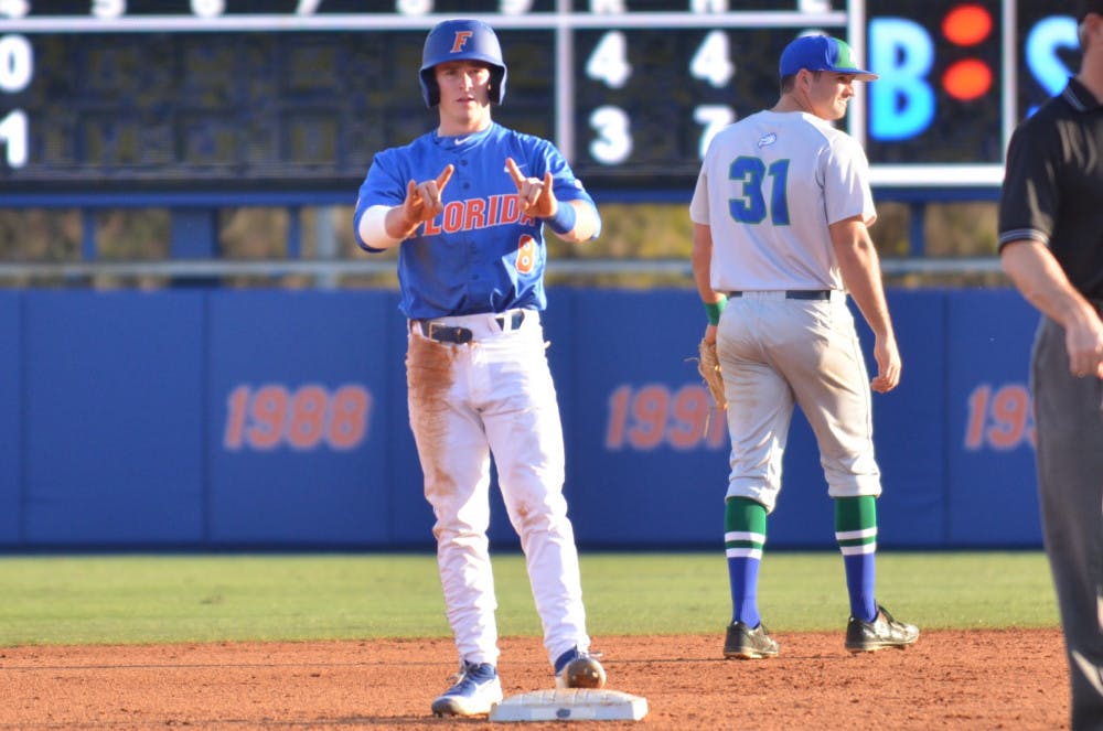 Deacon Liput celebrates after stealing second base during Florida's 8-4 win over Florida Gulf Coast on Feb. 20, 2016, at McKethan Stadium.