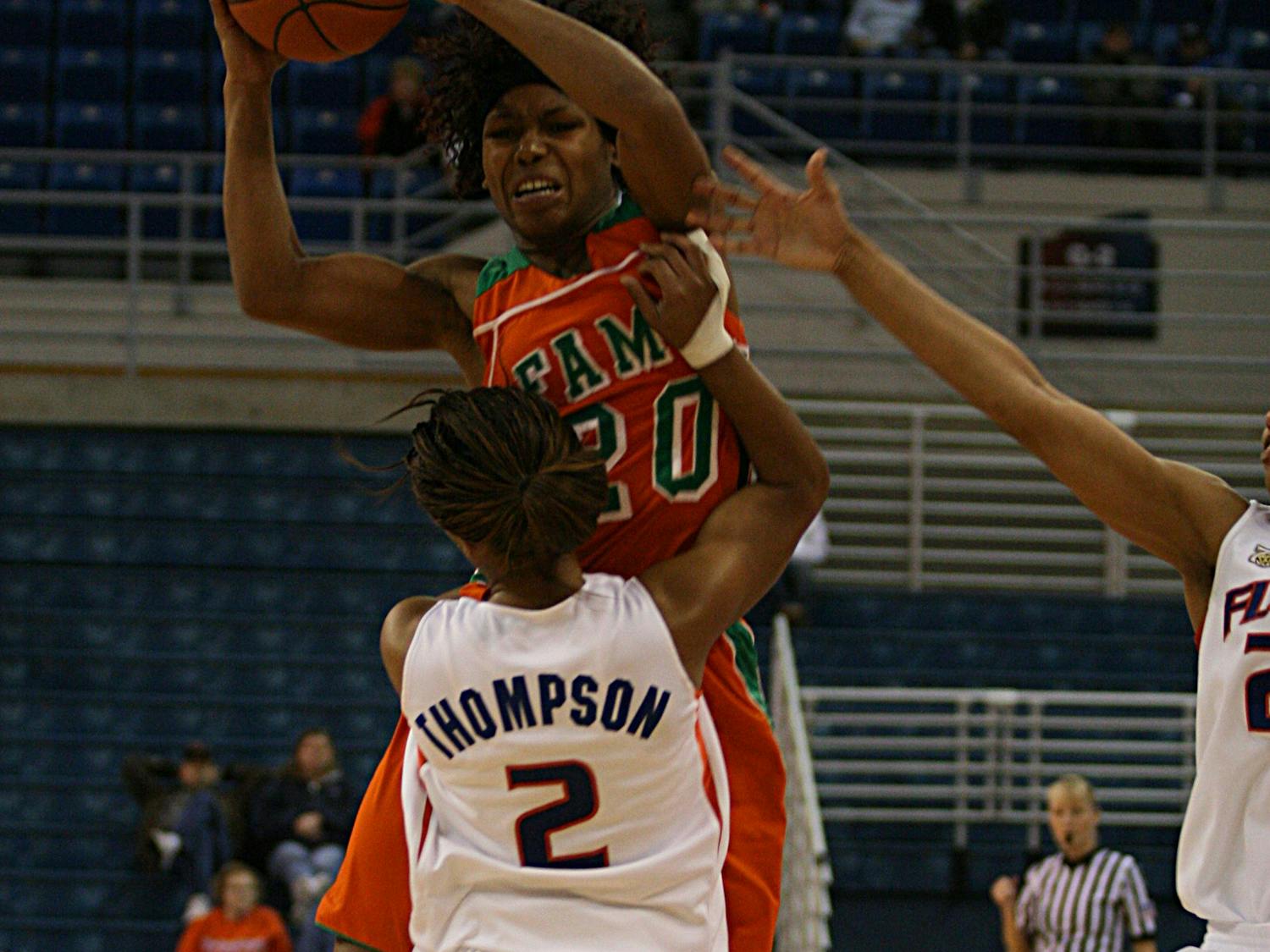 Lonnika Thompson blocks a shot during the Gators' 71-51 win against Florida A&M University on Jan. 2 at the O'Connell Center. (Jeremiah Stanley / Alligator)