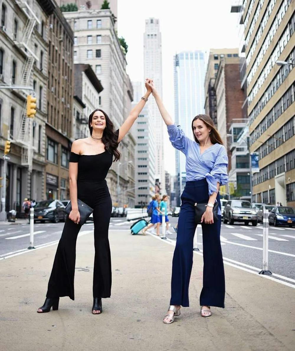 <p>Shir Ibgui, left, and Jamie Wilkinson, right, hold hands in the streets of New York City. The pair talks about their travels, food recommendations and wellness tips on their lifestyle blog, "NOTURAVG."</p>