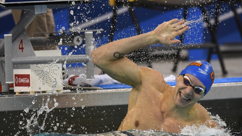<p>Senior Caeleb Dressel broke his own American, NCAA and UF record in the 100 fly on Friday night at the NCAA Championships, posting a first-place time of 42.80.</p>