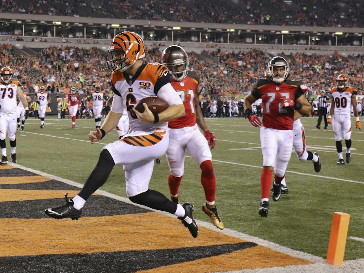 Cincinnati Bengals quarterback Jeff Driskel (6) runs in a touchdown during the second half of the team's preseason NFL football game against the Tampa Bay Buccaneers, Friday, Aug. 11, 2017, in Cincinnati. (AP Photo/Gary Landers)
