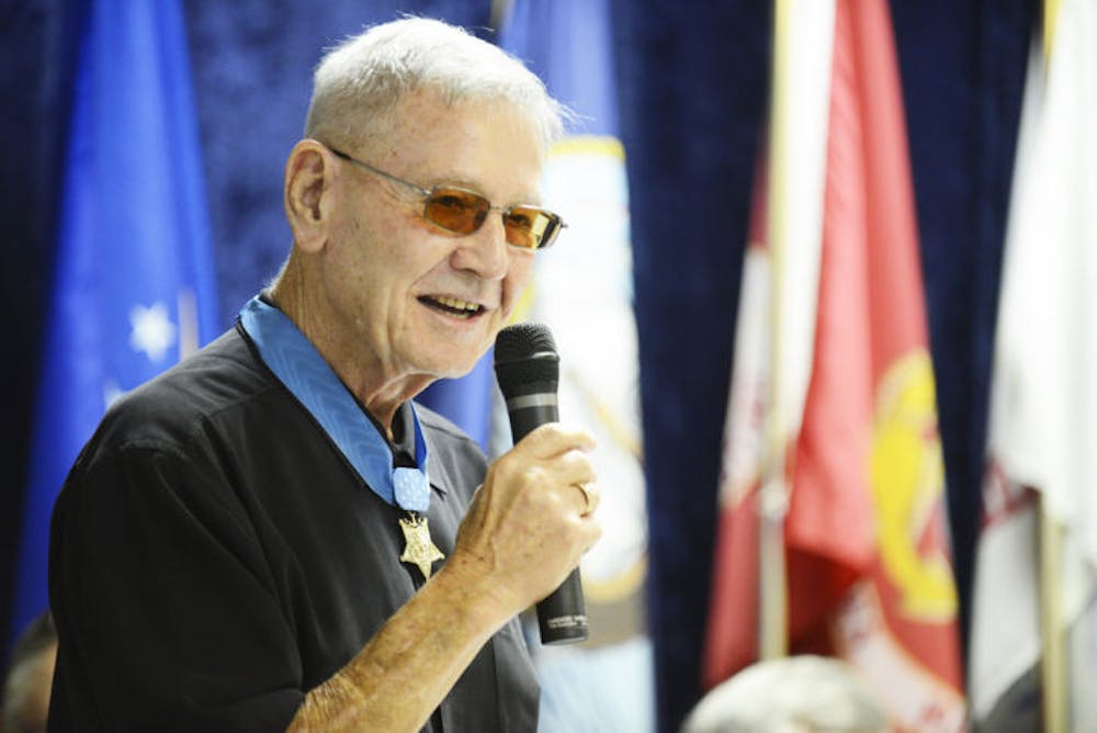 <p>Cpl. Duane E. Dewey, 81, addresses a small crowd gathered at the American Legion Haisley Lynch Post 16 in Gainesville in March 2013. Dewey was awarded the Medal of Honor in 1953 after his service in Panmunjom, Korea.</p>