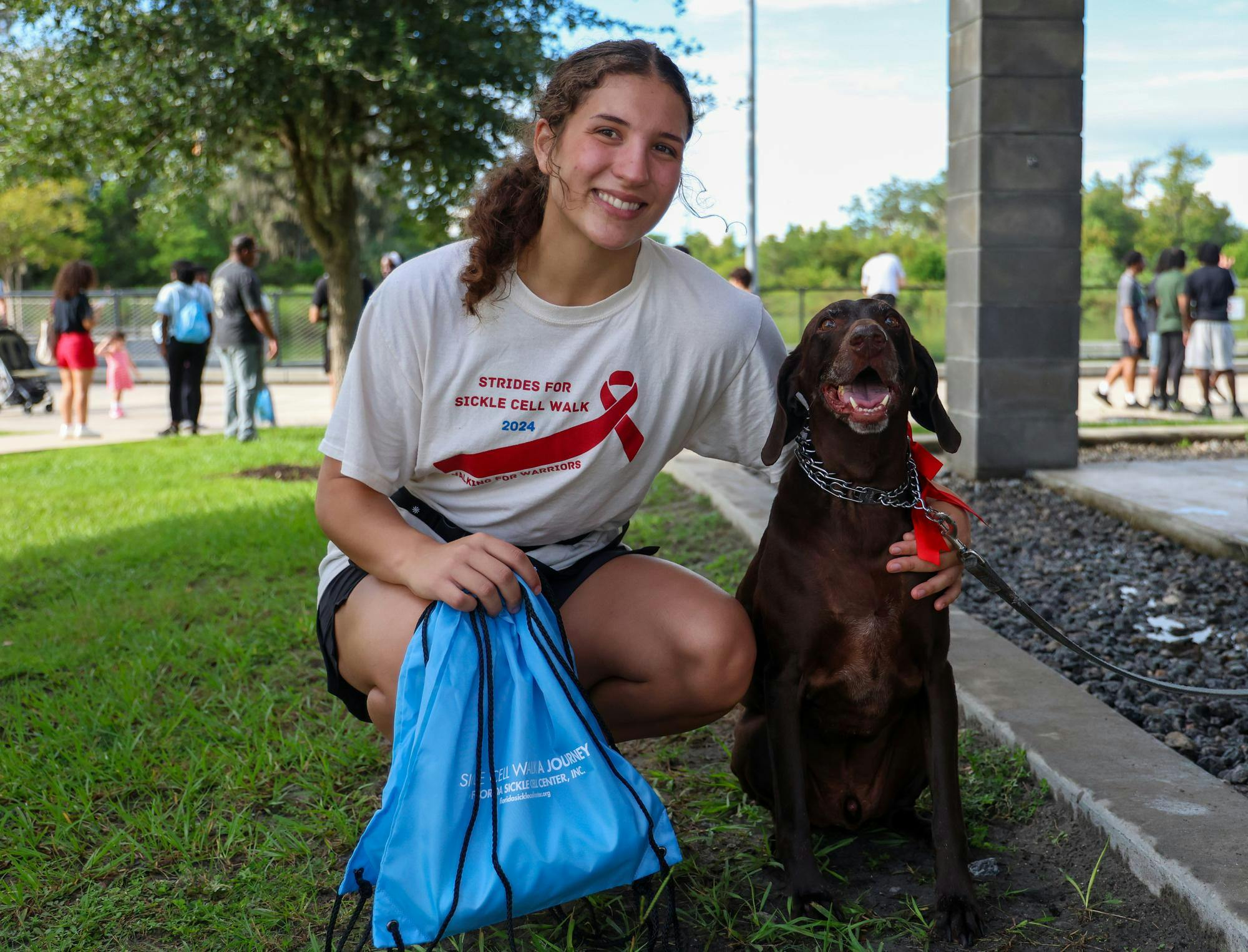 UF senior Christine Cana poses with her dog Brody at the 2026 Sickle Cell Walk on Monday, Sept. 7, 2026, in Gainesville, Fla.