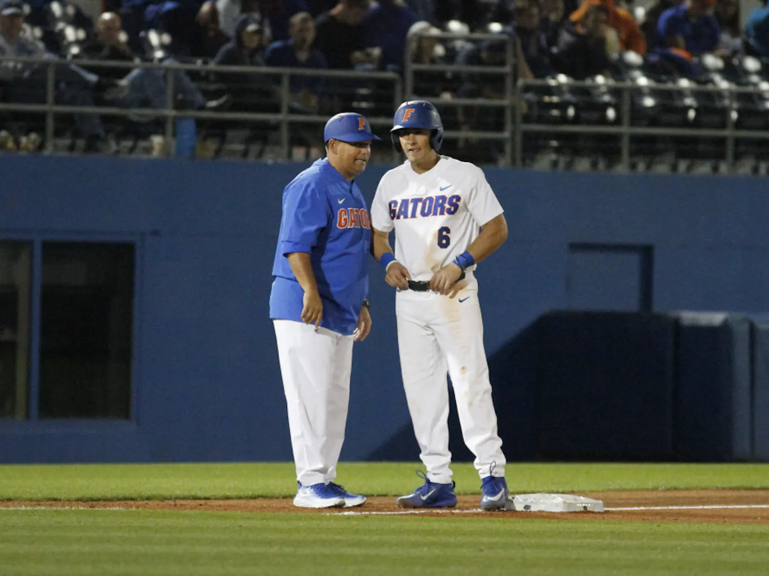 Jonathan India (right) stands on third base during Florida's 5-4 win over the William and Mary Tribe on Friday, Feb. 17, 2017, at McKethan Stadium.