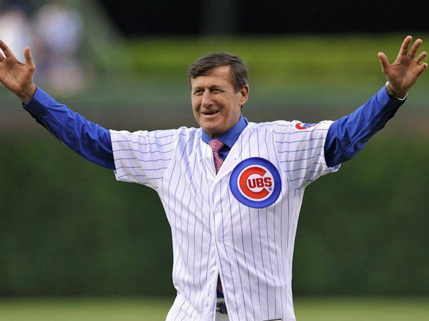 Craig Sager threw out the first pitch of a Cubs game in June 2016. He was a longtime NBA sideline reporter before his death in December 2016.