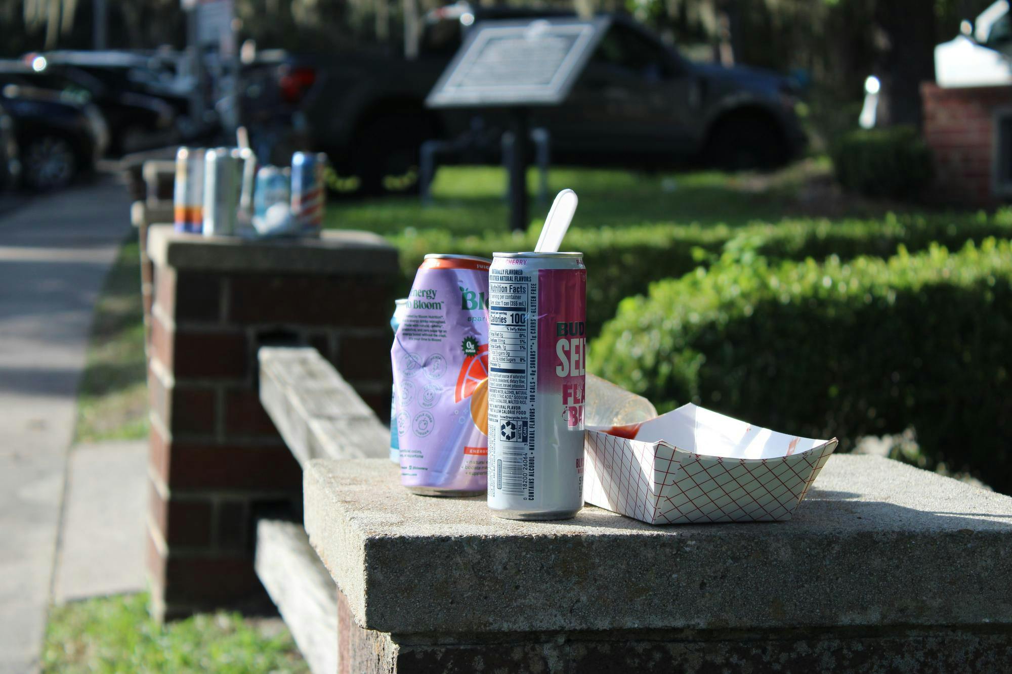 Empty cans and discarded trash sits outside tailgates on Fraternity Drive before the UF and Campbell University football game, Saturday, Sept. 12, 2026, in Gainesville, Fla.