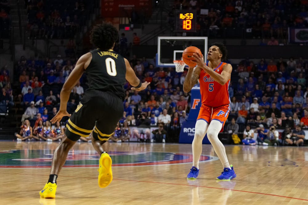 Gators men's basketball junior guard Will Richard begins to shoot the ball in the team's 77-64 win over the Vanderbilt Commodores on Saturday, February 24, 2024. 