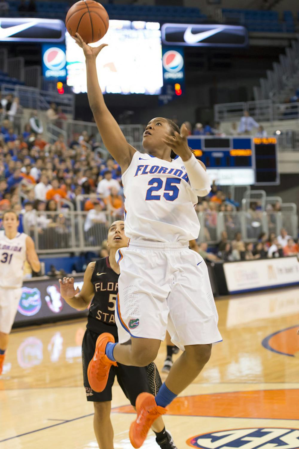 <p>Sophomore forward Christin Mercer attempts a layup during the Gators' 76-68 loss to the Seminoles on Thursday night in the O’Connell Center.</p>